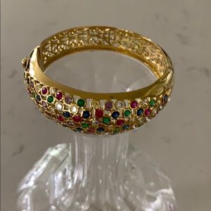 Gold bracelet with various stones. (Not real)